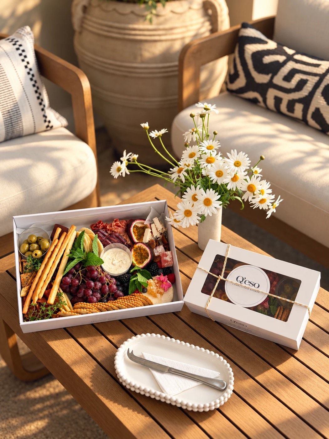 A grazing box of cheeses, cured meats, fruit and crackers, ready to share at the Placebo Bar